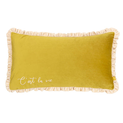 Yellow pillow with beige ruffle trim and 'C'est la vie' text on a white background