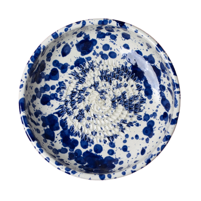 Ceramic bowl with blue speckled pattern