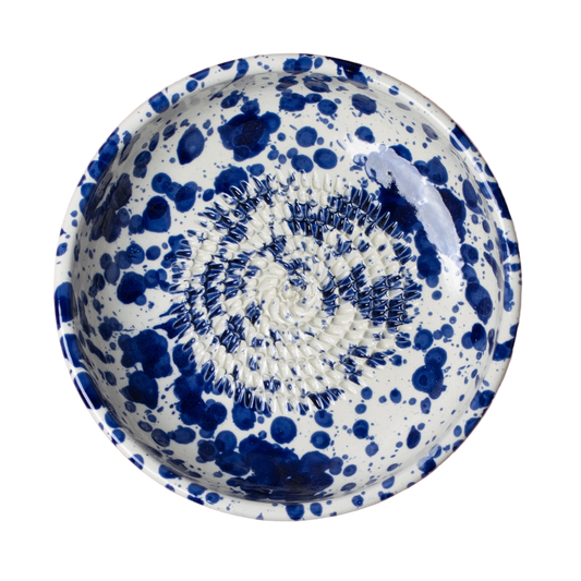 Ceramic bowl with blue speckled pattern